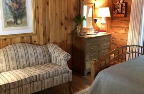 The Monument Room has a comfortable settee for sitting next to the dresser.