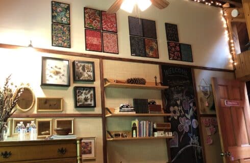The Taconic Room decor wall of interesting items has added several new to see including framed fabrics for far away places.
